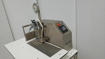 Machine d'application d'adh&eacute;sifs, t&ecirc;te unique