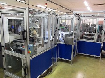 Machine de conditionnement, identification et transfert.